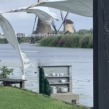 Kinderdijk - Bygone dish and laundry washing station in the canal. - Landmarks & Historical Buildings Near Me - Kinderdijk, ZH