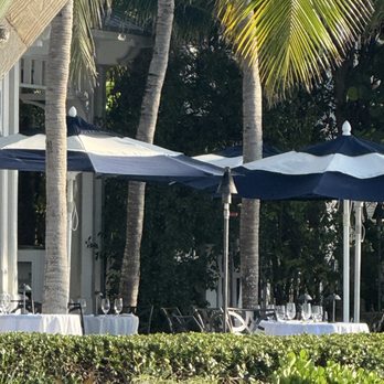 Latitudes Sunset Key Cottages - Empty tables at the restaurant - Seafood Near Me - Key West, Florida Latitudes Sunset Key Cottages - Empty tables at the restaurant - Seafood Near Me - Key West, Florida