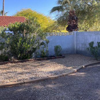 Desert Valley Irrigation - Side yard rock placed up to the oleander bed - Landscaping Near Me