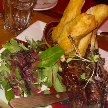 Omar's Kitchen and Rum Bar - Sorrel Glazed Lamb Chops. $37. Delicious. Served with one side (we chose festivals) - Caribbean Near Me - New York, New York Omar's Kitchen and Rum Bar - Sorrel Glazed Lamb Chops. $37. Delicious. Served with one side (we chose festivals) - Caribbean Near Me - New York, New York