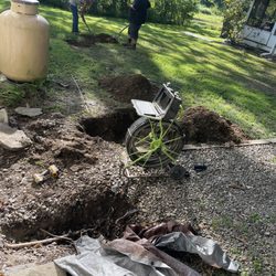 Mansfield Sanitation Services - Video camera at site of service. Workers filling dig spots.