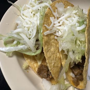 HP Taco Shop - What the "Famous Crunchy Tacos" look like at the restaurant. Taco kit hard shell, packaged lettuce, and a spoonful of meat. - Mexican Near Me - High Point, North Carolina