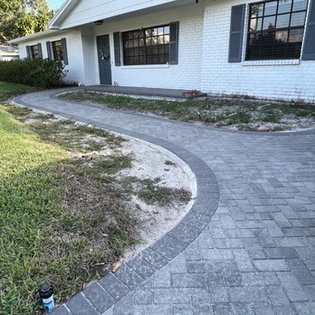 Tampa Landscape Solutions - a brick walkway in front of a house - Landscaping Near Me - Dover, Florida Tampa Landscape Solutions - a brick walkway in front of a house - Landscaping Near Me - Dover, Florida