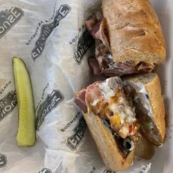 Medium brisket and cheddar with pepper and olives and side pickle.