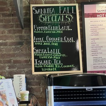 Sankofa Cafe - fall specials - A chalkboard at Sankofa Cafe lists fall specials such as pumpkin latte, apple orchard chai, Samoa latte, and island tea, with ingredients noted. - Coffee & Tea Near Me - Montclair, New Jersey