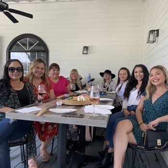 Ultimate Vineyards - Family enjoying new service on the freshly painted black and white porch. - Wineries Near Me - Temecula, California Ultimate Vineyards - Family enjoying new service on the freshly painted black and white porch. - Wineries Near Me - Temecula, California