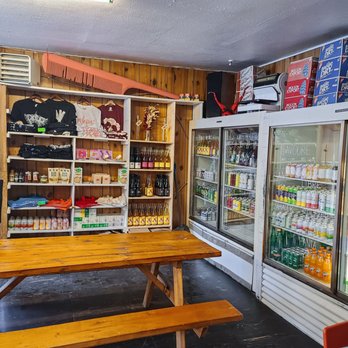 Le Pick-Up - a man standing in front of a refrigerator - Convenience Stores Near Me - Montreal, Quebec