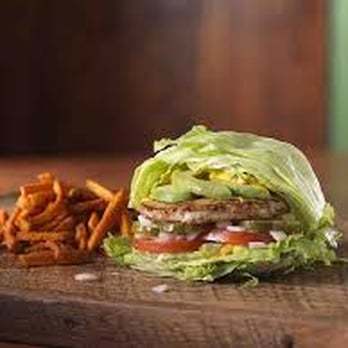 Mooyah - a burger and fries on a cutting board - Burgers Near Me - Chilliwack, British Columbia