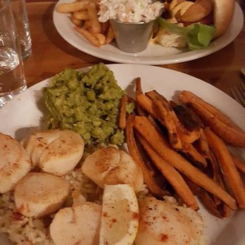 The Fish Friar - Scallop platter with roasted carrots and "mushy peas" in the front, spice po boy with fries and cole slaw in the back - Fish & Chips Near Me - Syracuse, New York The Fish Friar - Scallop platter with roasted carrots and "mushy peas" in the front, spice po boy with fries and cole slaw in the back - Fish & Chips Near Me - Syracuse, New York