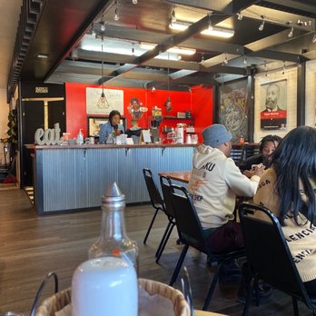 Shugs Comfort Food - people sitting at tables in a restaurant - Comfort Food Near Me - Bellevue, Nebraska Shugs Comfort Food - people sitting at tables in a restaurant - Comfort Food Near Me - Bellevue, Nebraska