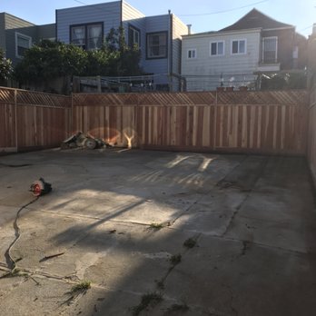 Sixto - a backyard with a fence and a fire hydrant - Gardeners Near Me Sixto - a backyard with a fence and a fire hydrant - Gardeners Near Me