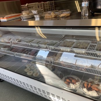 M&E Syrian Cuisine - a display case filled with donuts - Middle Eastern Near Me - North Providence, Rhode Island
