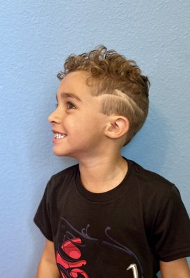 Kids Cuts - From fun designs to sharp fades, we make kids’ haircuts a cool and comfortable experience!
As a family-owned barbershop, we know how to treat every child with care, patience, and skill. Whether it’s their first trim or a fresh new style, our professional barbers deliver top-notch quality in a friendly, family-focused environment.
We specialize in trendy looks, clean cuts, and happy smiles. Parents love our attention to detail — kids love the fun vibe. At our shop, every haircut is a chance to shine. Come in for the style, stay for the experience.
Call Now To Make An Appointment! Kids Cuts - From fun designs to sharp fades, we make kids’ haircuts a cool and comfortable experience!
As a family-owned barbershop, we know how to treat every child with care, patience, and skill. Whether it’s their first trim or a fresh new style, our professional barbers deliver top-notch quality in a friendly, family-focused environment.
We specialize in trendy looks, clean cuts, and happy smiles. Parents love our attention to detail — kids love the fun vibe. At our shop, every haircut is a chance to shine. Come in for the style, stay for the experience.
Call Now To Make An Appointment!