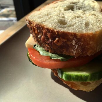 The Ledge Community Coffee House - a sandwich on a table - Coffee & Tea Near Me - Squamish, British Columbia The Ledge Community Coffee House - a sandwich on a table - Coffee & Tea Near Me - Squamish, British Columbia