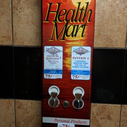 Chevron #20 - Condom machine in the ladies one stale restroom.
