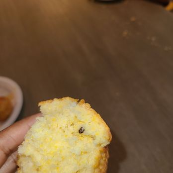 The Fresh Market - a hand holding a half eaten muffin - Grocery Near Me - Charlotte, North Carolina The Fresh Market - a hand holding a half eaten muffin - Grocery Near Me - Charlotte, North Carolina
