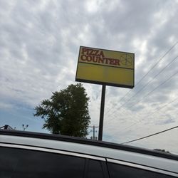 The pizza counter sign