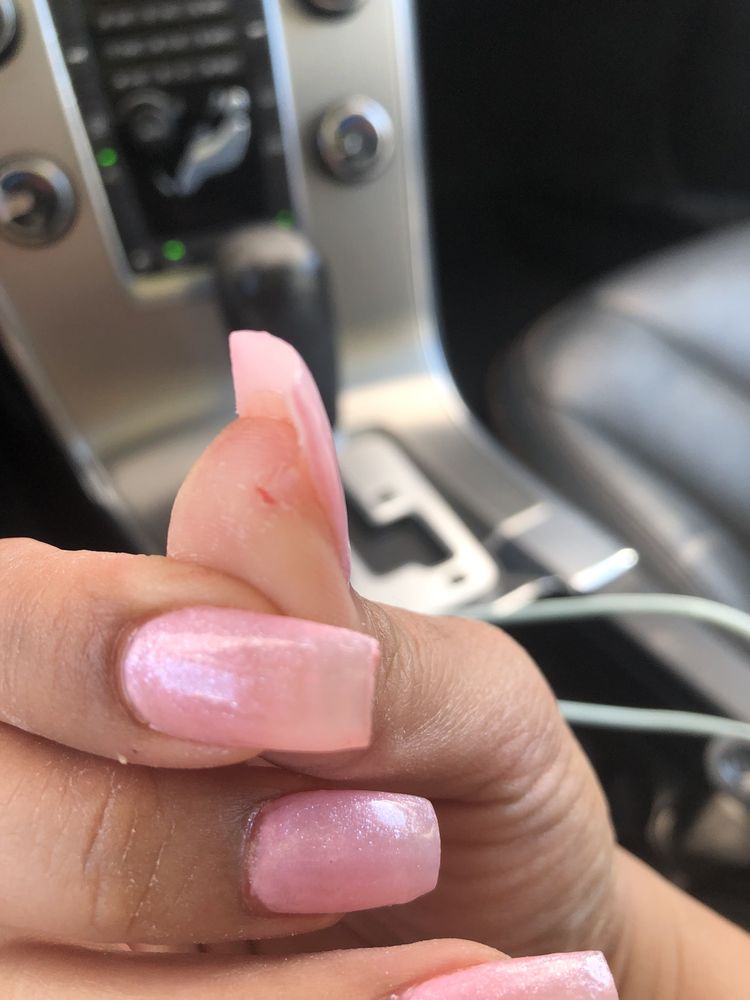 Nails and Rays Logo