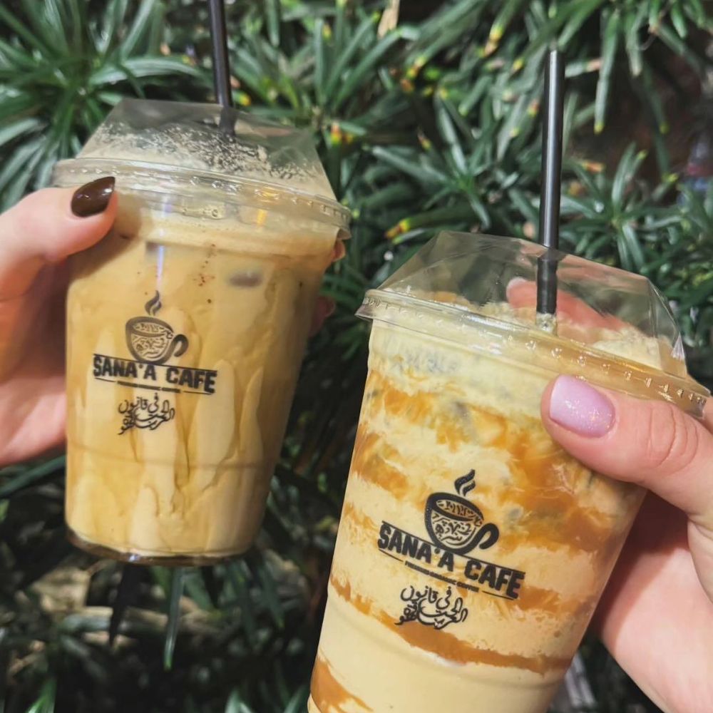 Sana'a Cafe - Biscoff Latte on the right and their signature latte on the left - Coffee & Tea Near Me - Sacramento, California Sana'a Cafe - Biscoff Latte on the right and their signature latte on the left - Coffee & Tea Near Me - Sacramento, California