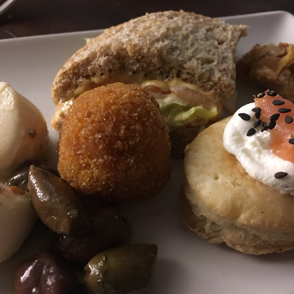 Enoteca Ferrara - Aperitifs - mozzarella, kalamata olives, fried cheesey rice ball, Lox biscuit and a fried chicken (?) thigh...may be quail - Wine Bars Near Me - Rome, RM Enoteca Ferrara - Aperitifs - mozzarella, kalamata olives, fried cheesey rice ball, Lox biscuit and a fried chicken (?) thigh...may be quail - Wine Bars Near Me - Rome, RM