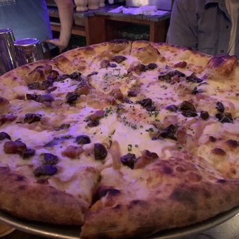 Baker's Bar - Special mushroom pie (no sauce) with cheese, caramelized onion, a cracked egg, and chorizo. I had three slices of this ish. - Bars Near Me - Charleston, South Carolina