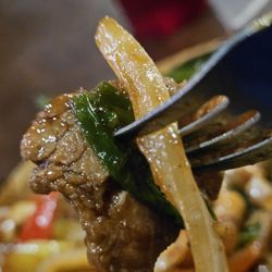 Taste of Asia - A fork with a piece of the main entrée.