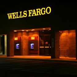 Wells Fargo Bank - Walk up ATM machines lit at night.