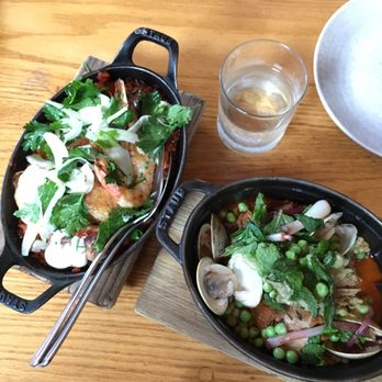 Avec - Chicago - Half portion paella (left), pork shoulders (right) - Mediterranean Near Me - Chicago, Illinois