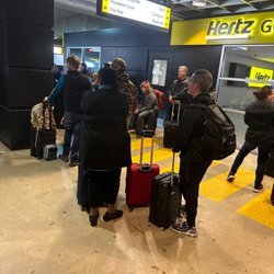 Hertz Rent A Car - Waiting for rentals. More (about triple) inside the building behind us.