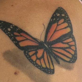 Golden Sparrow Tattoo - Beautiful resting monarch. - Tattoo Near Me - Downers Grove, Illinois Golden Sparrow Tattoo - Beautiful resting monarch. - Tattoo Near Me - Downers Grove, Illinois