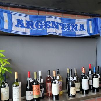 Pampa Argentine Grill & Bar - bottles of wine lined up on a bar - Argentine Near Me - Katy, Texas Pampa Argentine Grill & Bar - bottles of wine lined up on a bar - Argentine Near Me - Katy, Texas