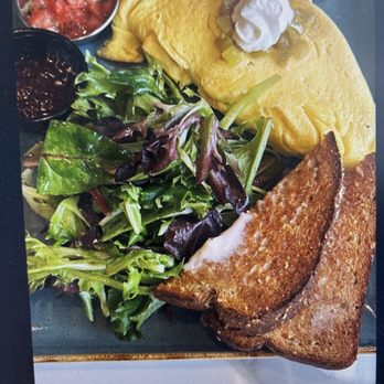 First Watch - Chili chorizo omelette with greens and multigrain toast included. You can choose other side options. - Breakfast & Brunch Near Me - Doylestown, Pennsylvania