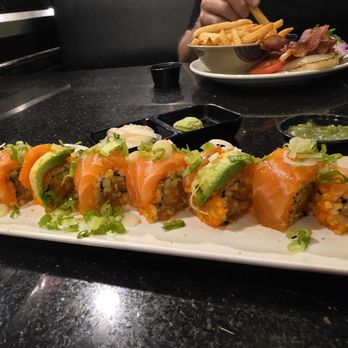 Kisho Japanese Restaurant - Beautiful Salmon Roll with added masago and Brown Rice - Sushi Bars Near Me - Valencia, California Kisho Japanese Restaurant - Beautiful Salmon Roll with added masago and Brown Rice - Sushi Bars Near Me - Valencia, California