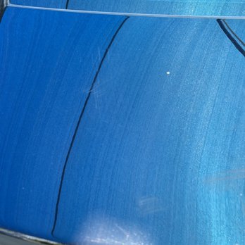 Chevron - a close up of the hood of a blue car - Gas Stations Near Me - Los Angeles, California