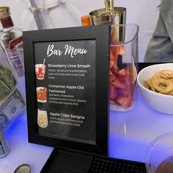 Infinite Sips - a bar menu on a table - Bartenders Near Me