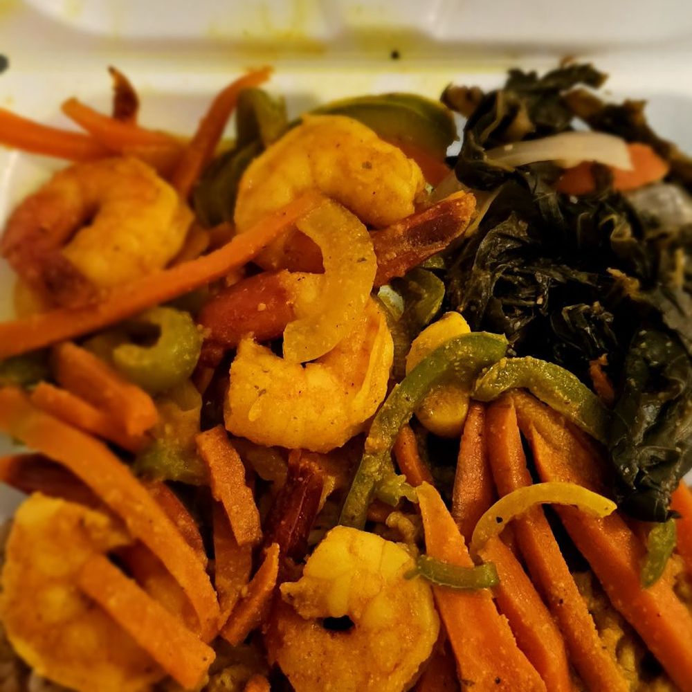 Irie Nation Restaurant - University - Curry shrimp with peas and rice and collards - Caribbean Near Me - Charlotte, North Carolina Irie Nation Restaurant - University - Curry shrimp with peas and rice and collards - Caribbean Near Me - Charlotte, North Carolina