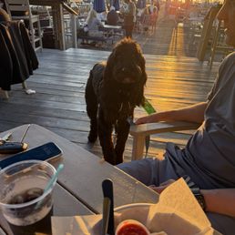 Sitting on the patio at Marina Bar & Grill enjoying the food and a sunset. Sitting on the patio at Marina Bar & Grill enjoying the food and a sunset.