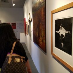 El Museo Cultural De Santa Fe - My mom admiring the artwork.