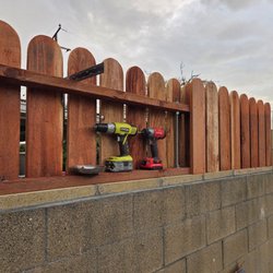 B&S construction - Assembly of hand cut solid Redwood pickets.