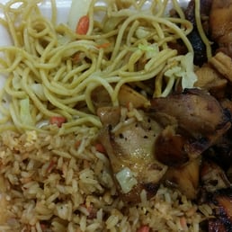 chicken, rice, and vegetables in a styrofoam container