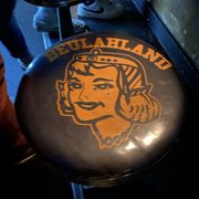 Photo of Beulahland - Portland, OR, United States. Barstools with this intriguing logo.