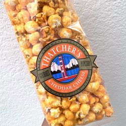 Thatcher's Gourmet Popcorn - Big fan of the cheddar cheese. :) Much fresher and way tastier than the one in typical holiday buckets!