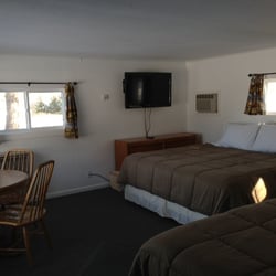East Jordan Motel - Room 8. has a king bed, double bed and an addition room with bunks.