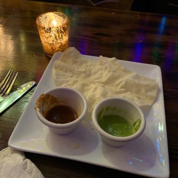 Sathi - Yummy complimentary starter :) it's crunchy and comes with two sauces, one is sweet and the green one is spicy! - Indian Near Me - New York, New York