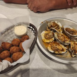 Steamed garlic oysters and Fried hush puppies Steamed garlic oysters and Fried hush puppies