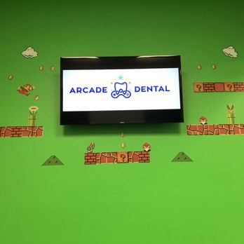 Arcade Dental - Pharr - Consultation room and hallways have gaming decor. Very welcoming for children. - General Dentistry Near Me - Pharr, Texas