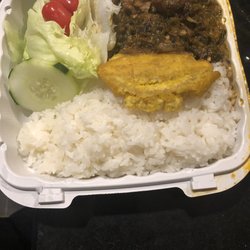 Legumes white rice, fried plantains and salad