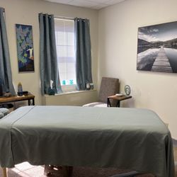 Tiny Pine Massage - Clean and serene treatment room.