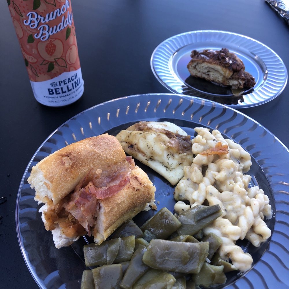 Tailgate food with a falcons hoagie, green beans and mac and cheese, pecan pie, and a hard cider Tailgate food with a falcons hoagie, green beans and mac and cheese, pecan pie, and a hard cider