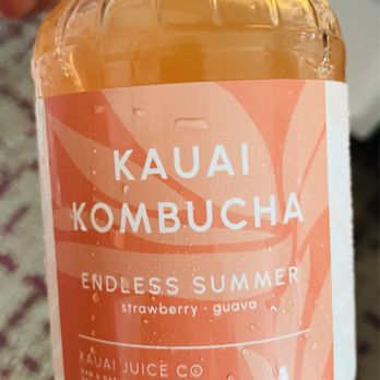 ABC Store - a person holding a bottle of kombucha - Convenience Stores Near Me - Lihue, Hawaii
